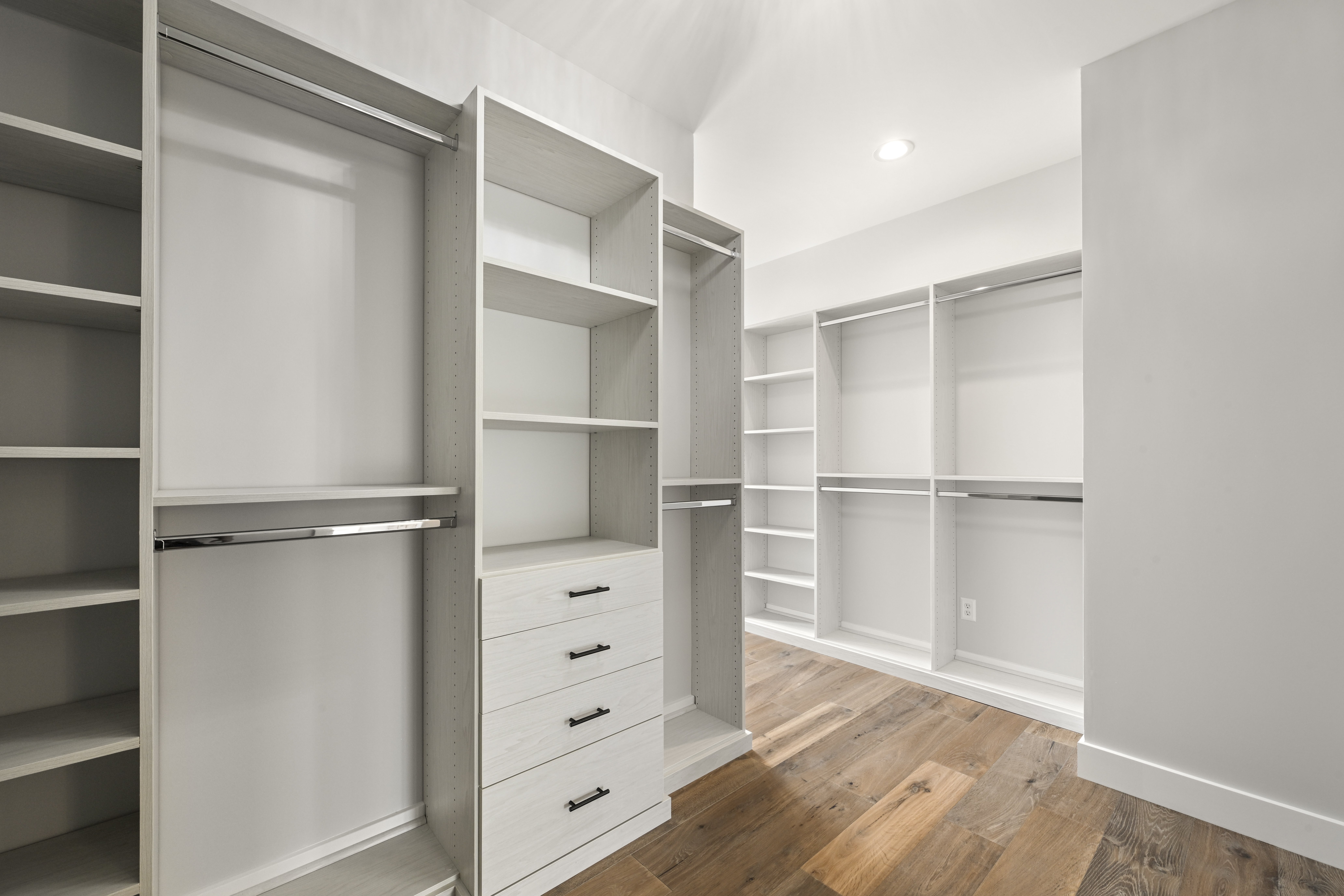 Master closet island and built-in storage in luxury home