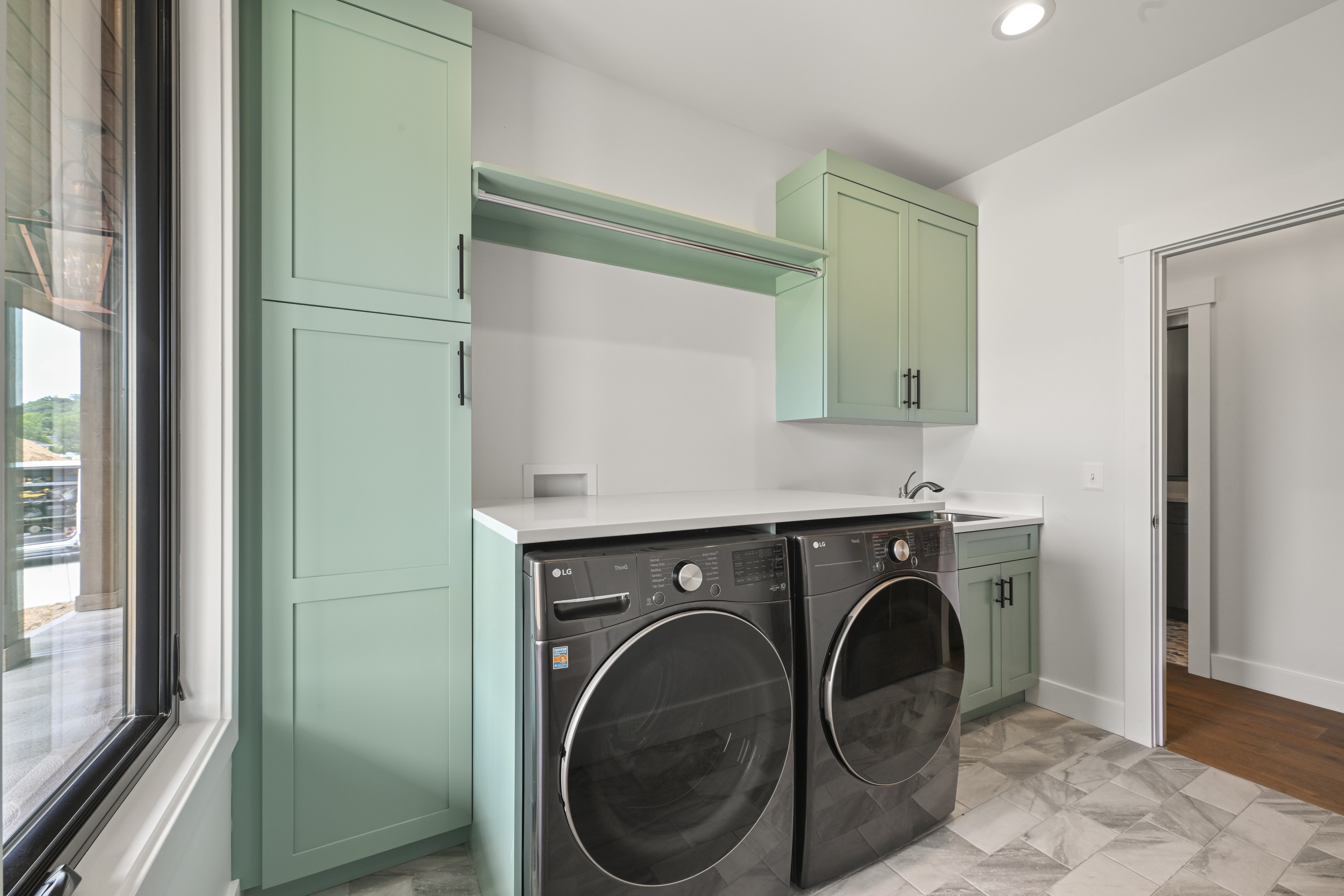 Spa-inspired master bathroom with double vanity and marble counters