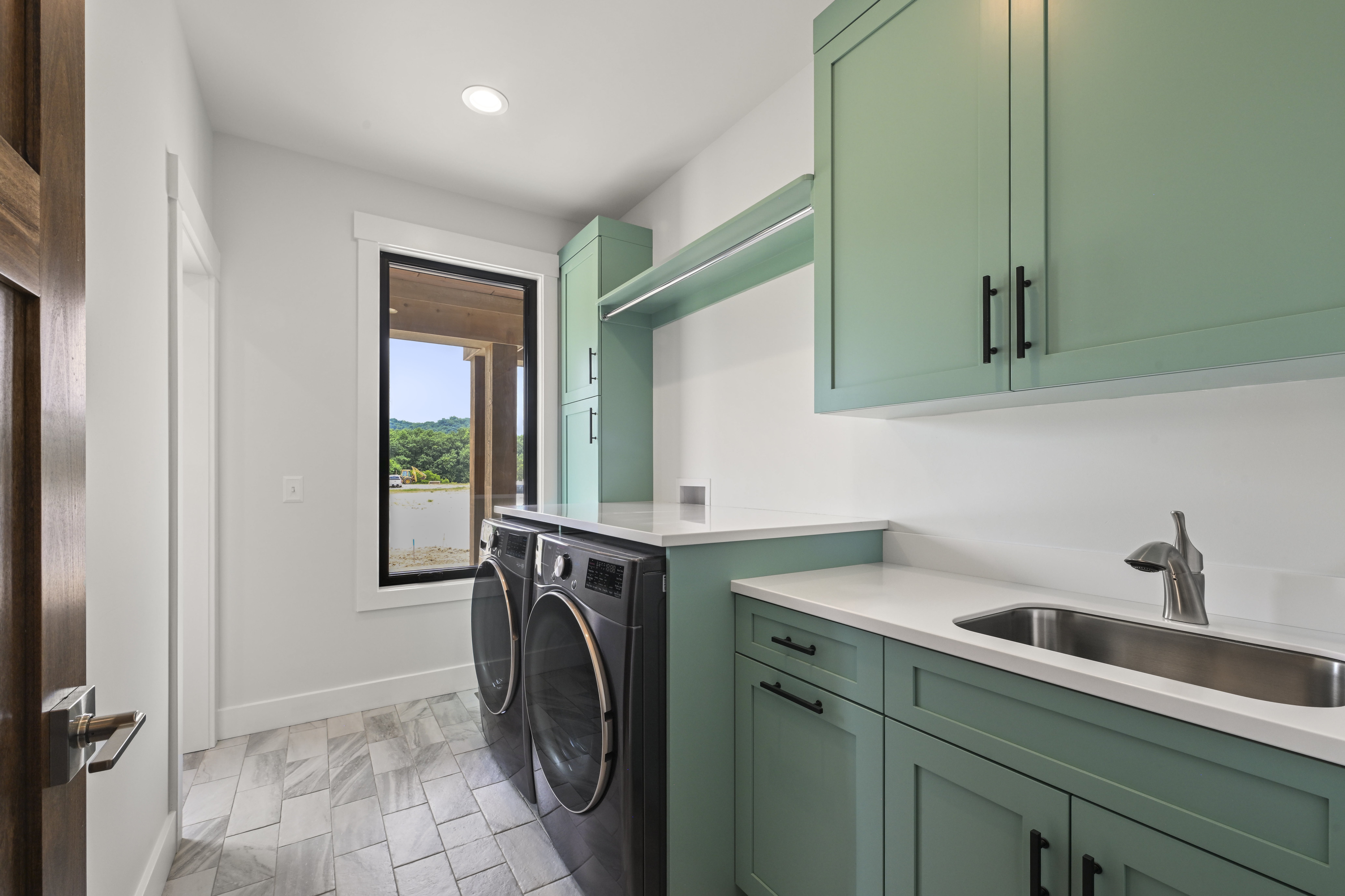 Walk-in shower with glass enclosure and tile surround in master bath