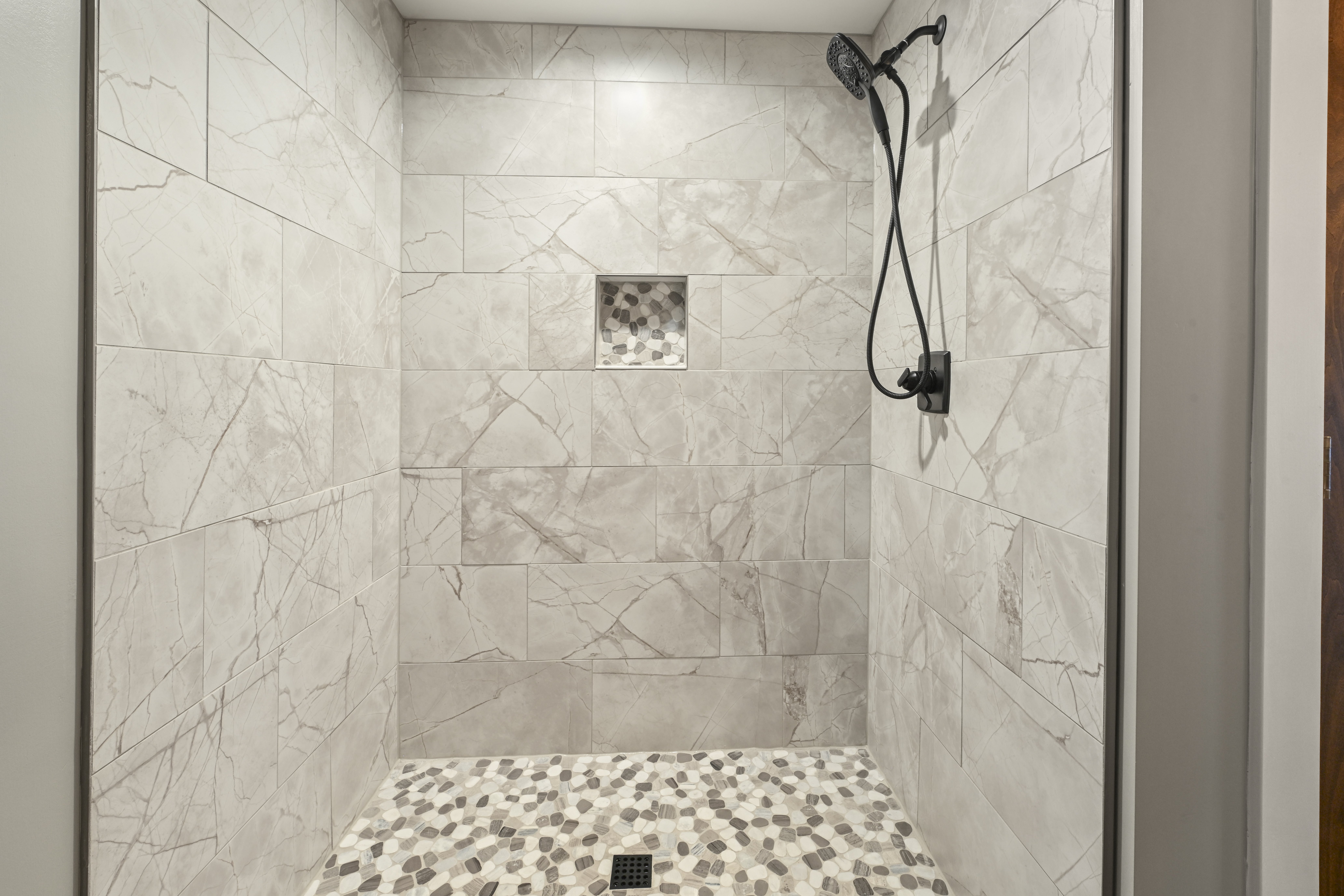 Double vanity with framed mirrors in master bathroom