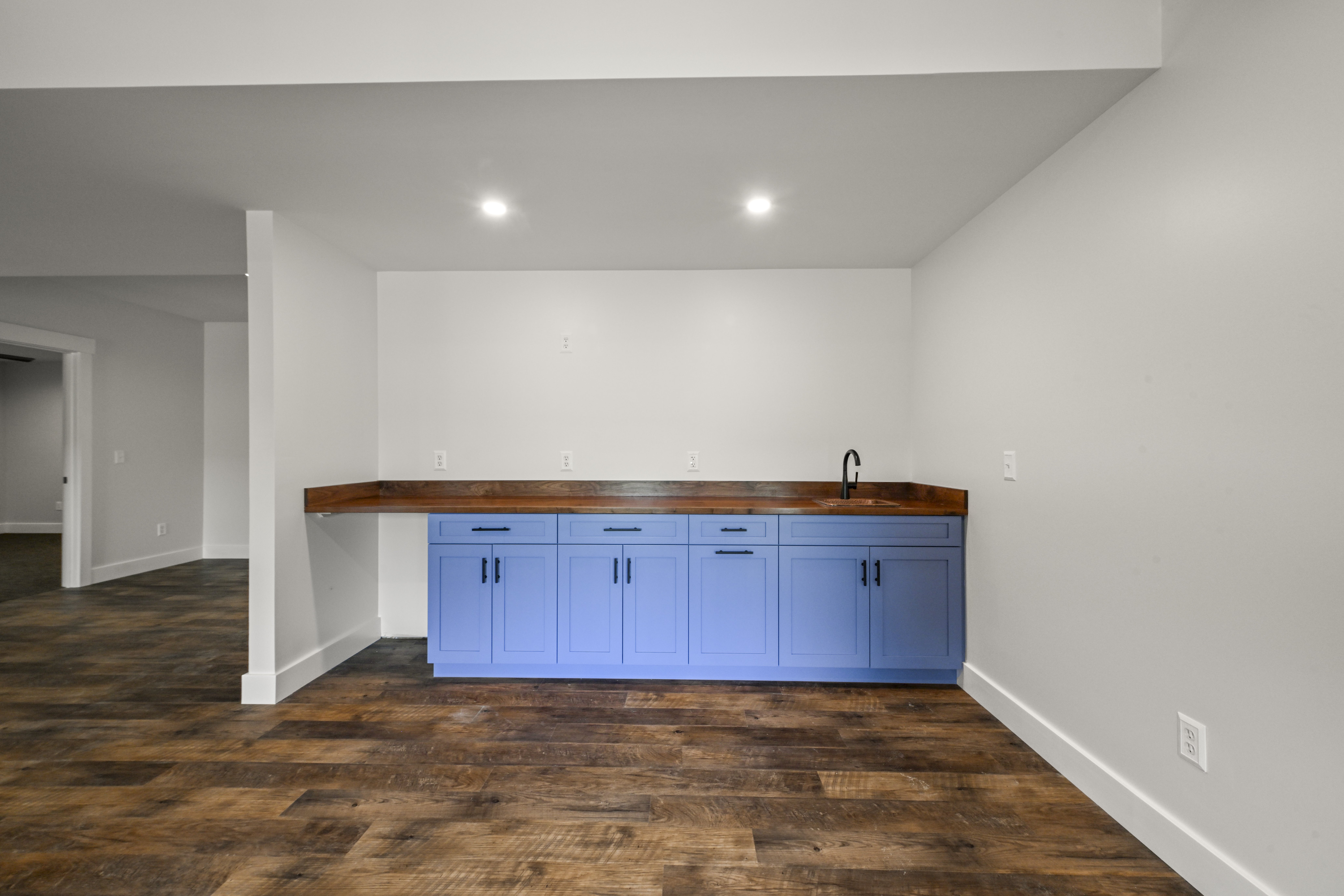 Third bedroom with carpet and natural light in custom home