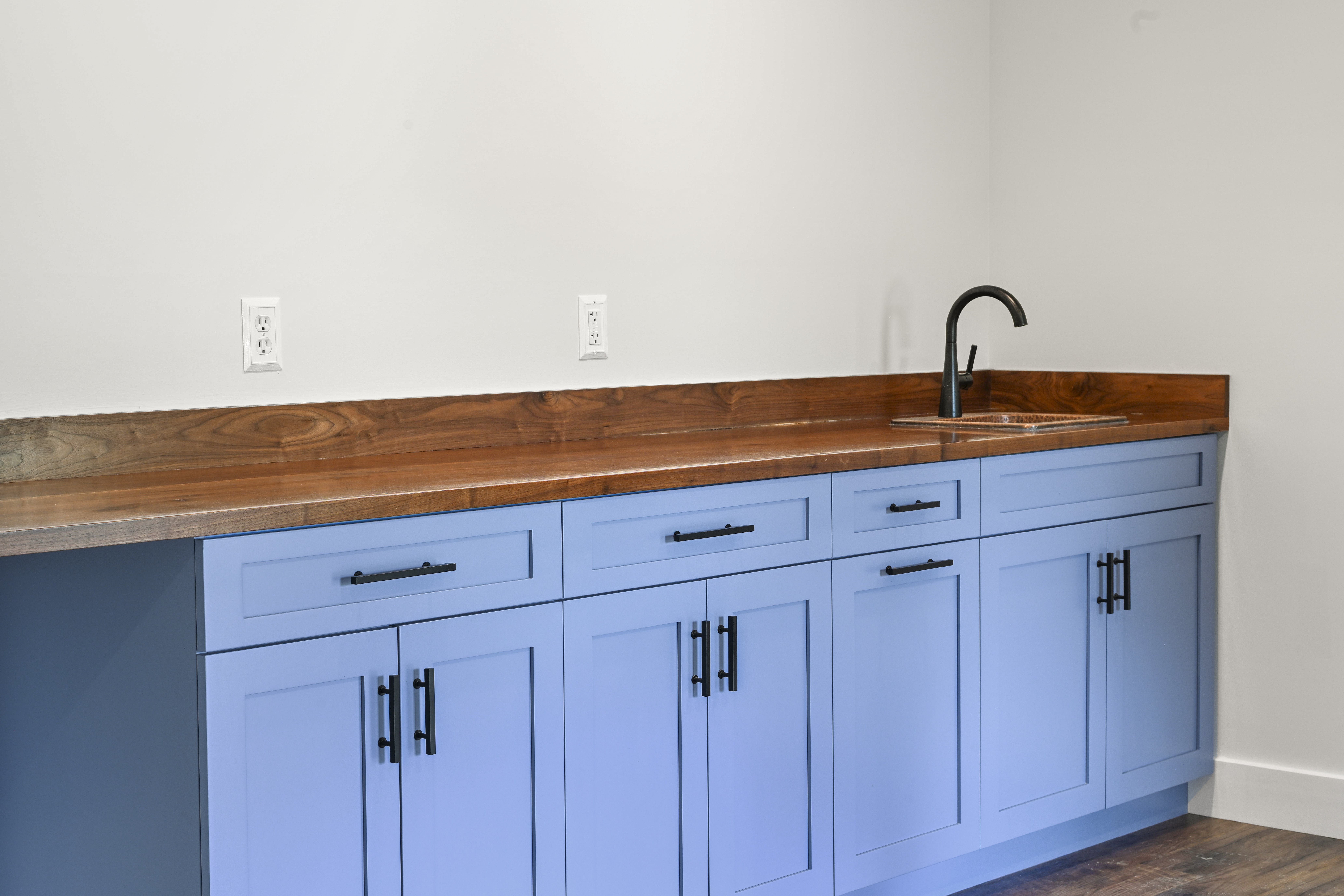 Mudroom with built-in lockers and bench in custom home