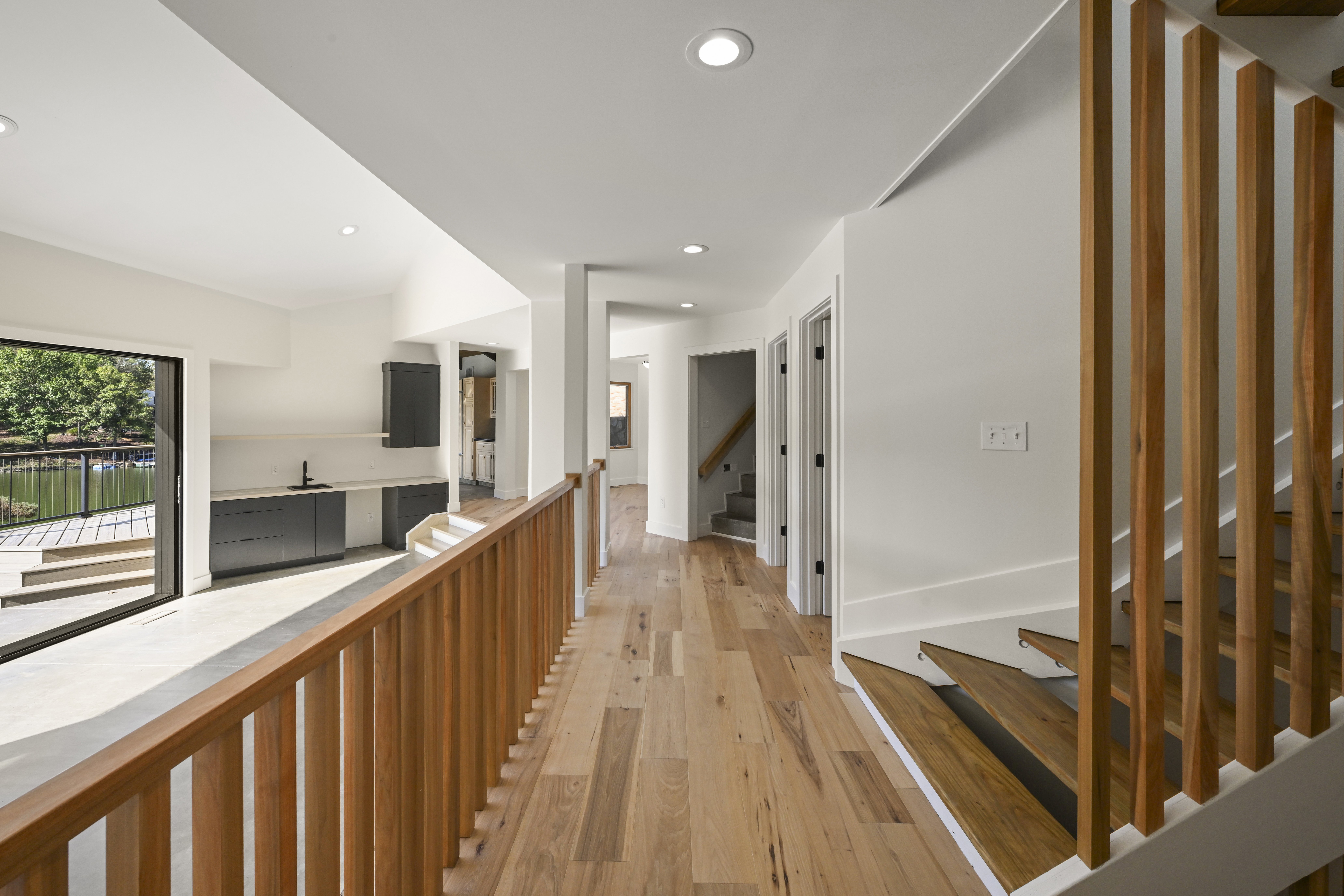 Open-concept living space with natural light in custom home