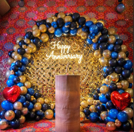 Golden Backdrop with Blue and Black balloon