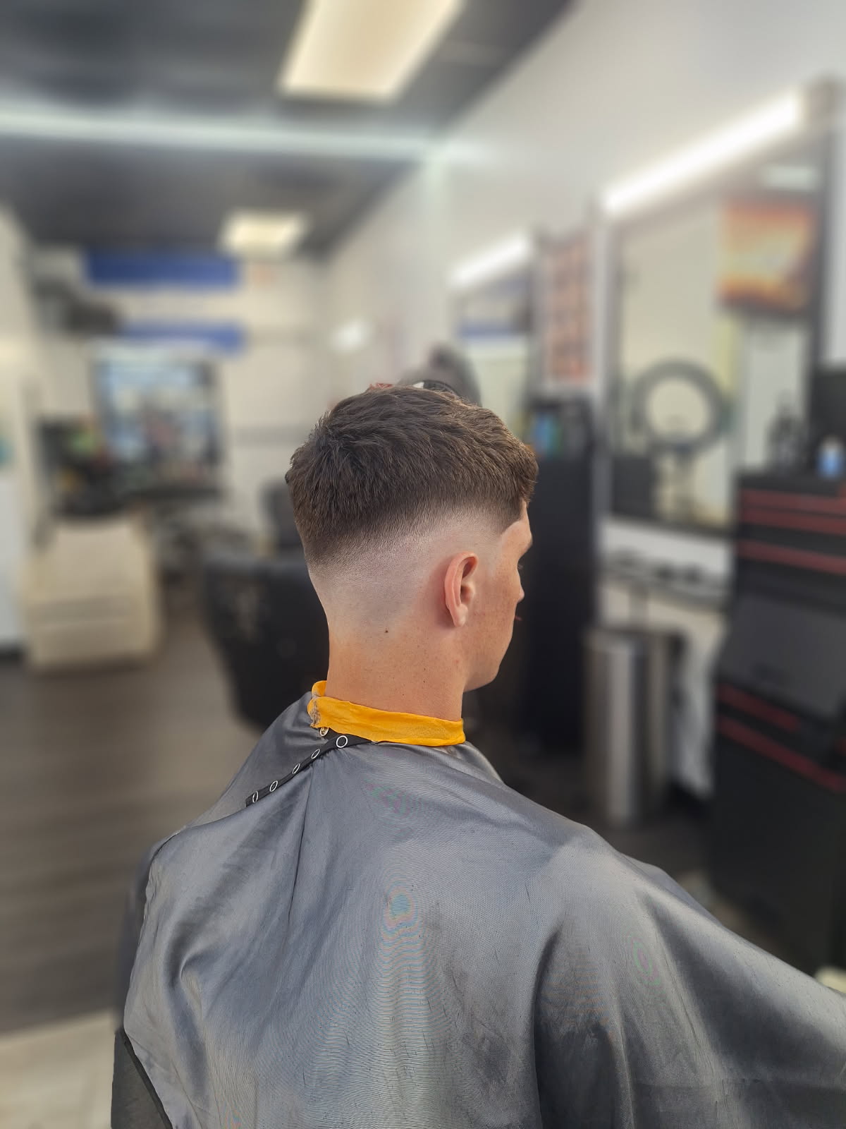 Customer haircut finish at Famous Barbershop