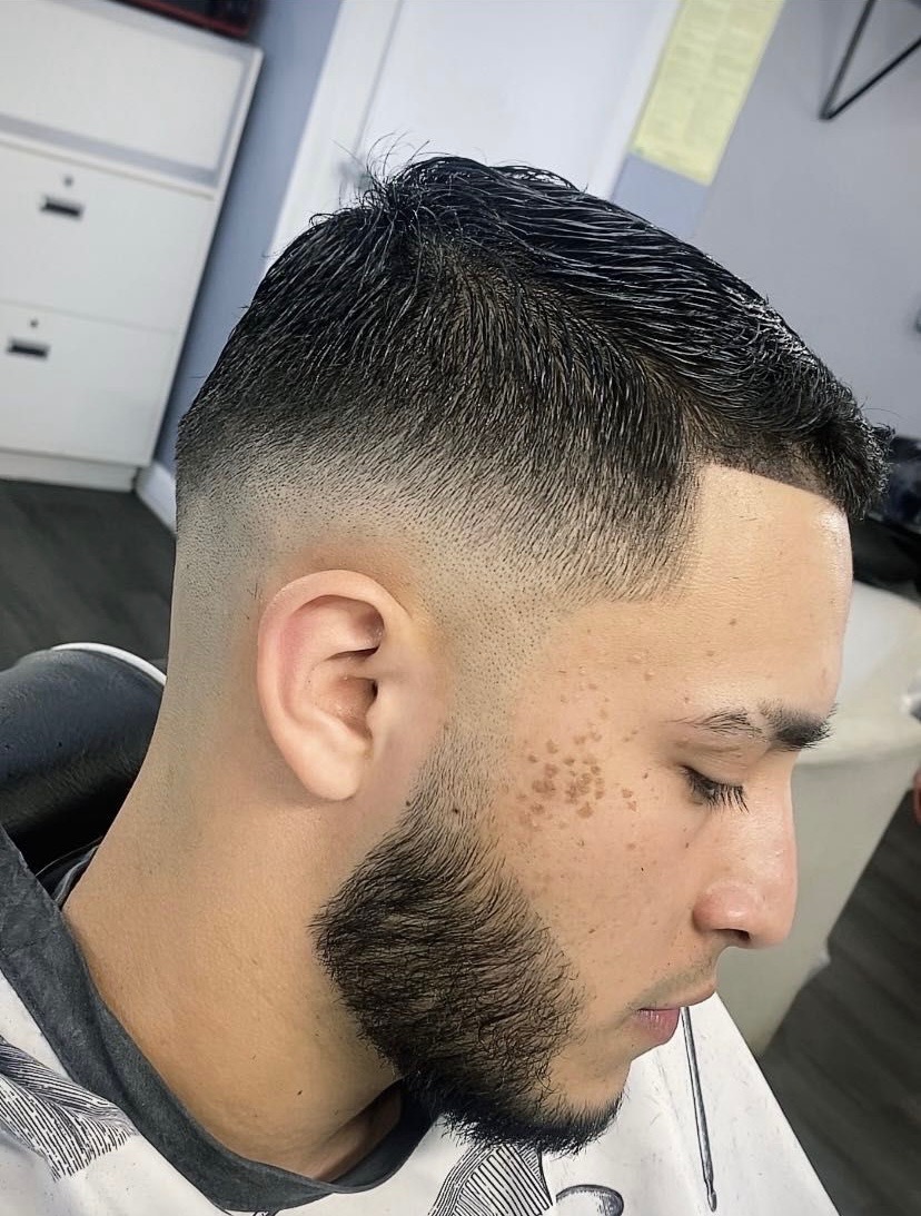 Clean fade haircut at Famous Barbershop