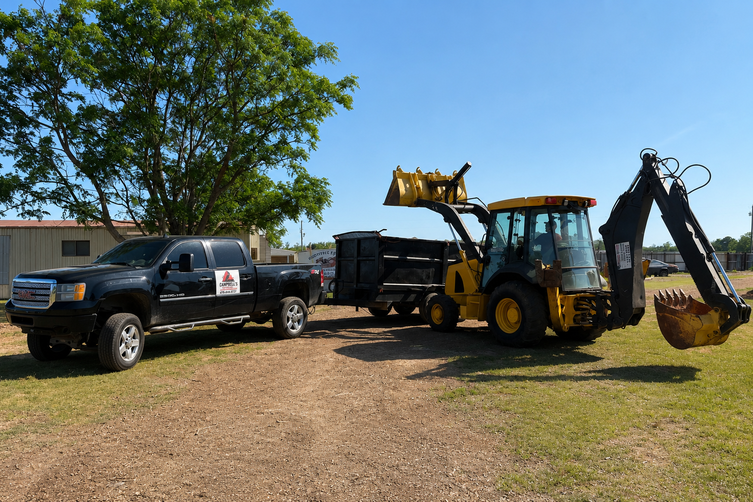 Heavy equipment performing land clearing and excavation on a Campbell's Construction & Hauling job site