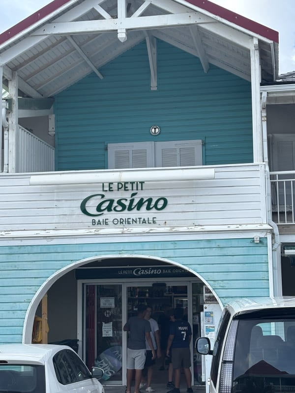 Le Petit Casino exterior at Orient Bay — the turquoise Caribbean building you walk past every day on your way to the beach.