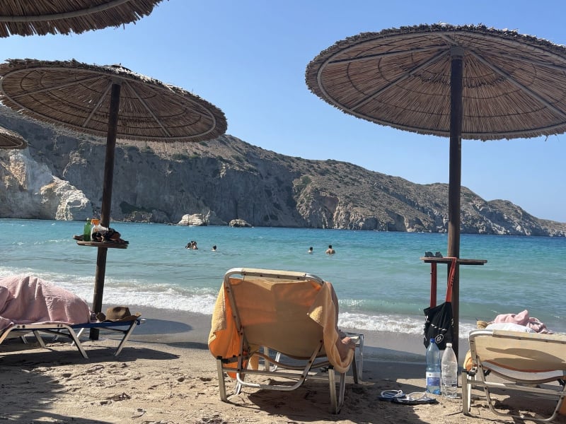 The cliffs behind Agia Kyriaki have been sitting there a long time. They've earned the audience.