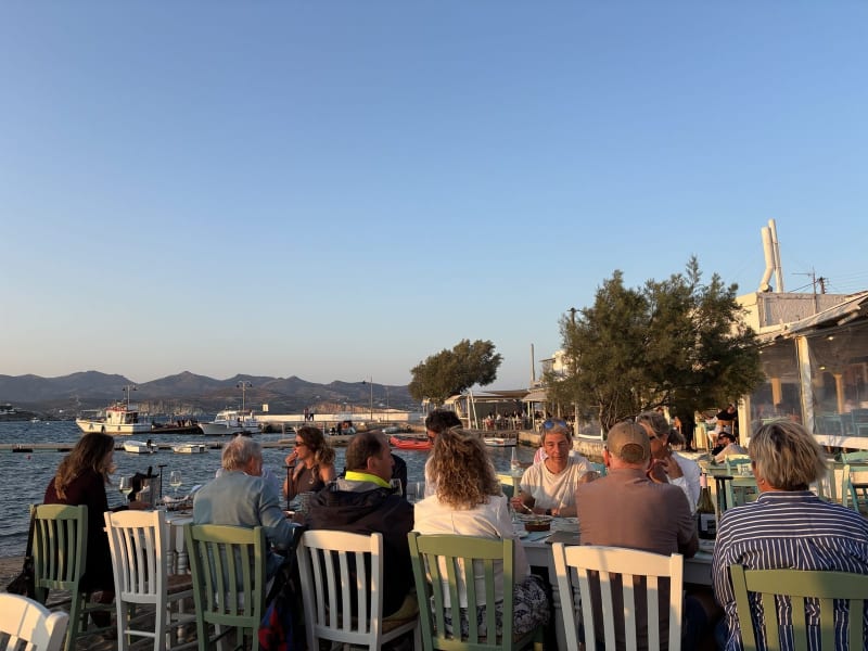 Every table faces the water. The boats bob while you eat. Nobody is in a hurry.