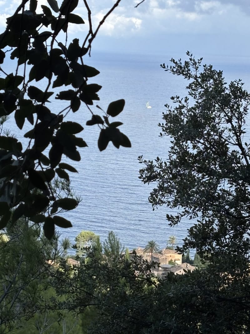 A sailboat in the distance, a village below, and the feeling that time moves differently here.