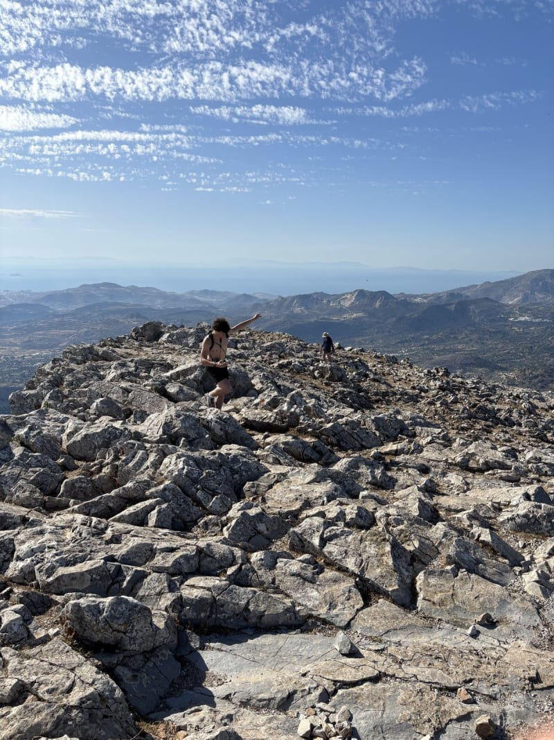 At the top of Mount Zas — the highest point in the Cyclades. The arm says everything.