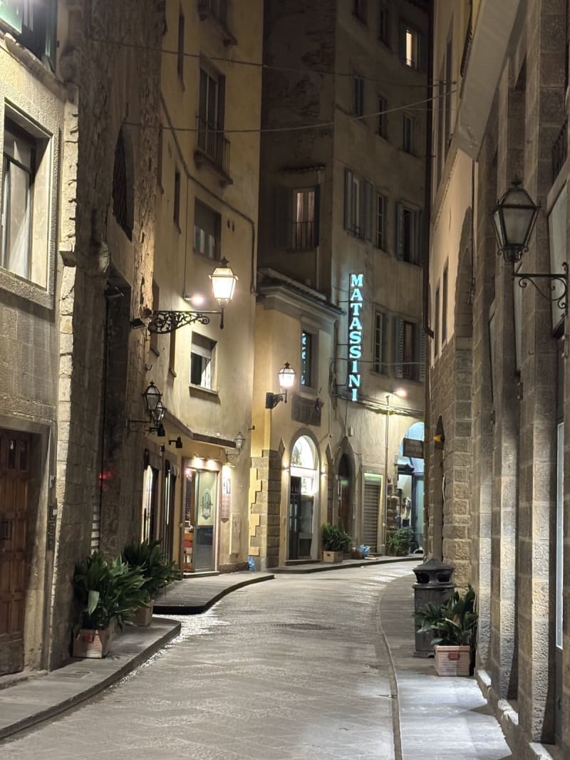 Florence after dark. The Matassini alley at 11pm — quiet enough to hear your own footsteps.