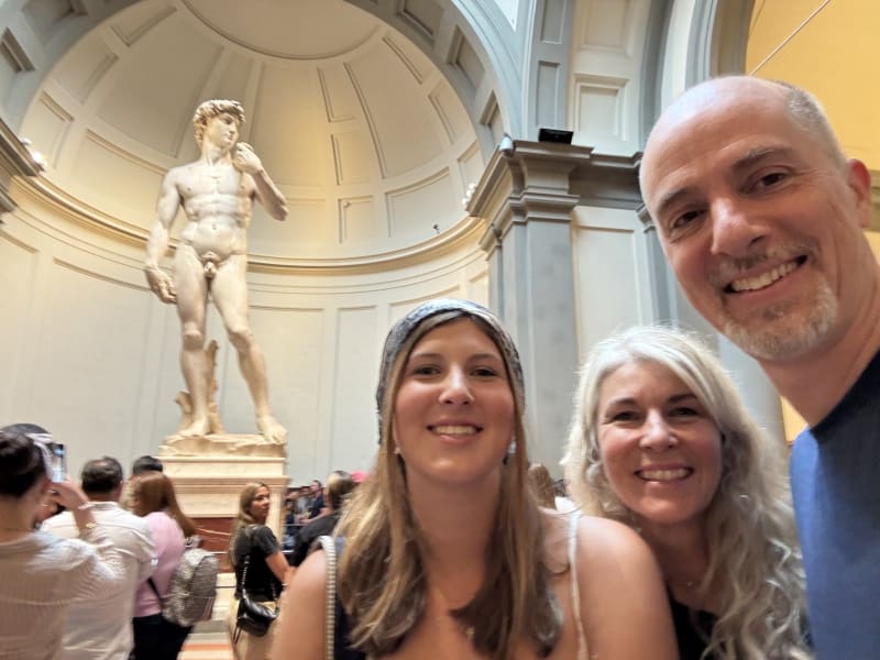 In front of Michelangelo's David at the Galleria dell'Accademia. No photo prepares you for how large he actually is.