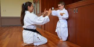 a karate teacher with child