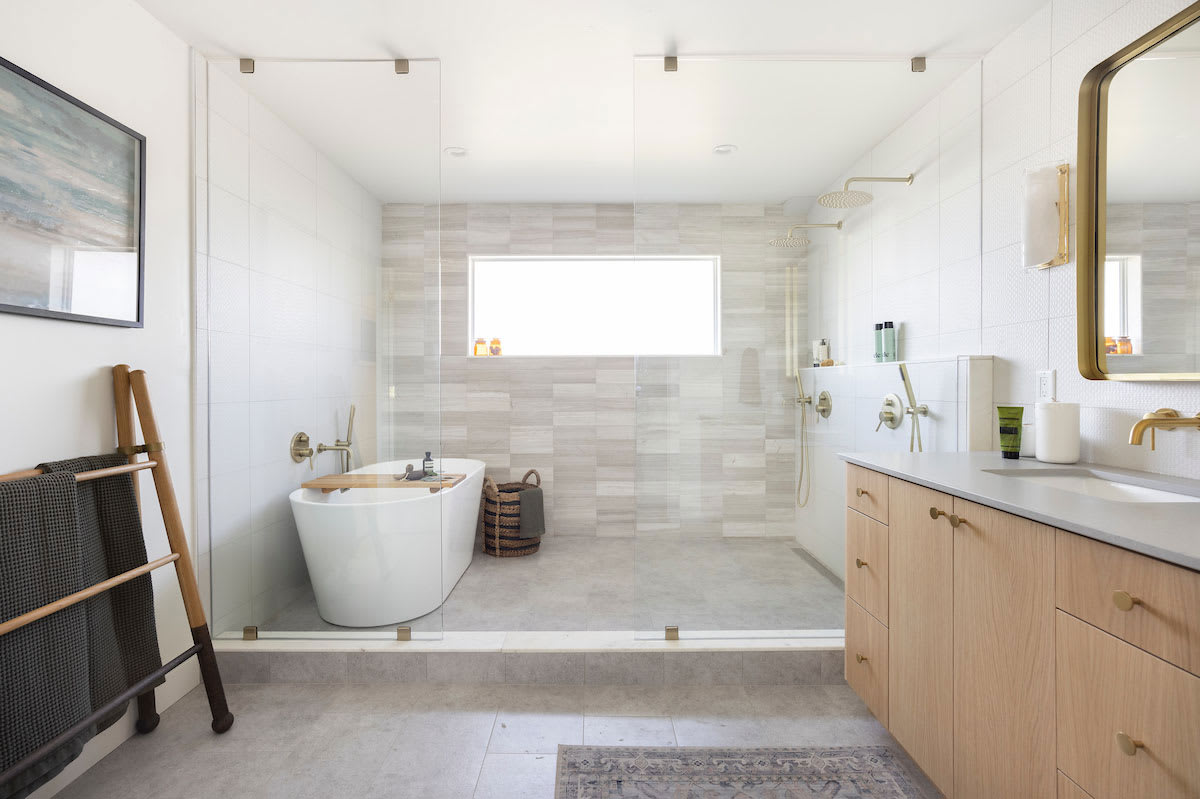 Large and open master bathroom with soaking tub and rainfall shower head.