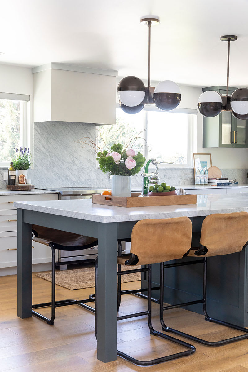 Open kitchen remodel with seating area built into the bar. Sleek and bright.