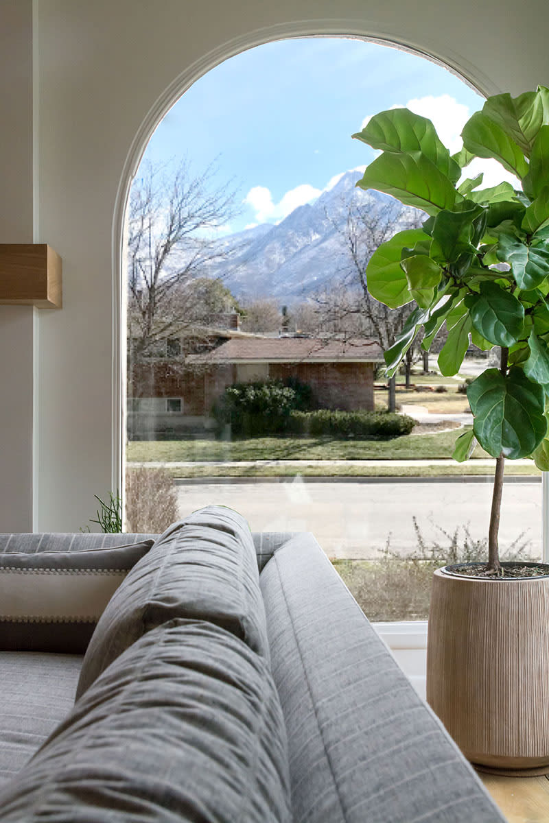 Large and bright arched window in this home remodel.