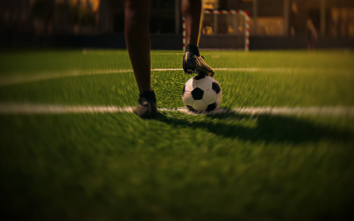 Football player on a grassroots pitch