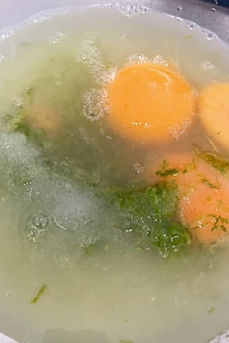 Sugar, lime zest and juice mixed with the egg yolks