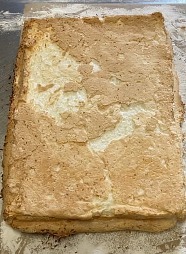 Cooked roulade with the baking parchment lining paper removed.