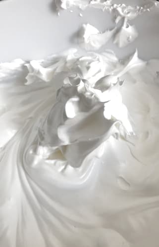 Stiff and shiny white meringue.