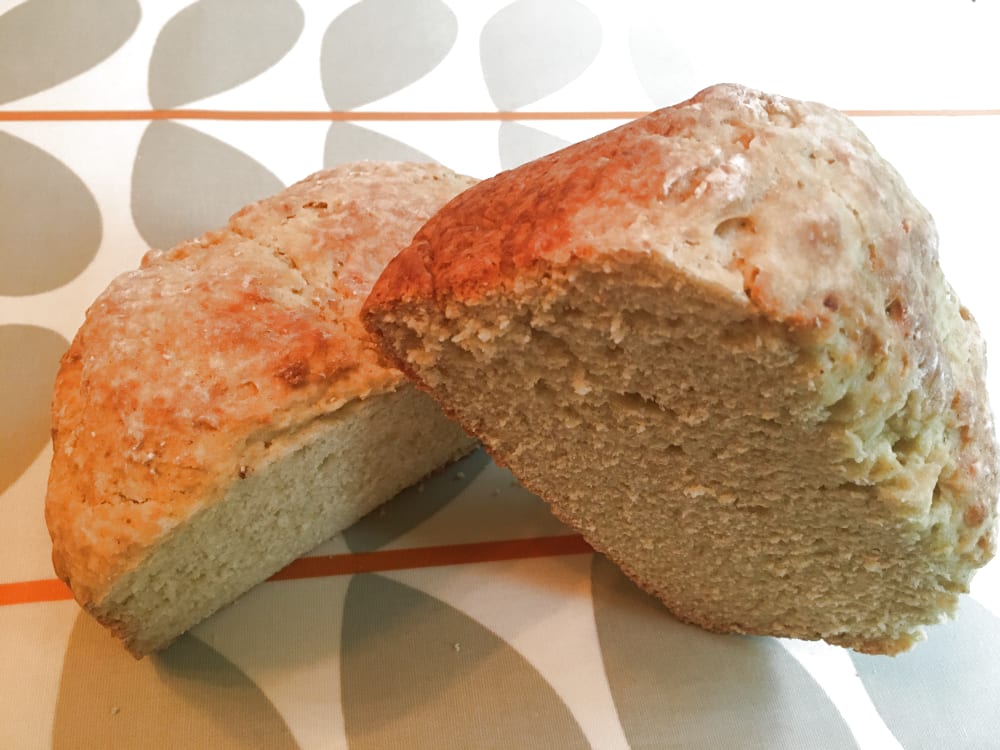White soda bread cut in half on table White soda bread cut in half on table