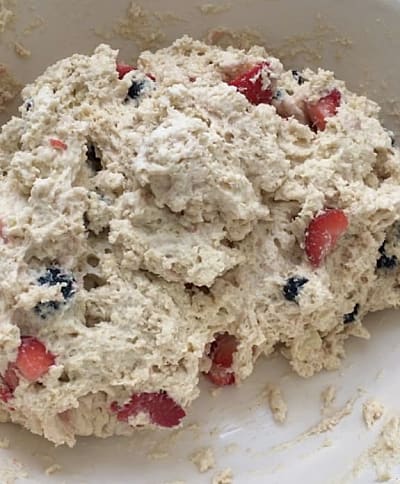 Soft dough mixture with strawberries and blueberries