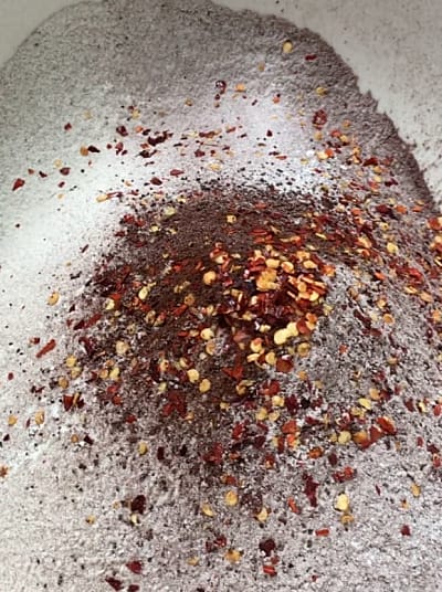 Chilli flakes on top of the flour mixture