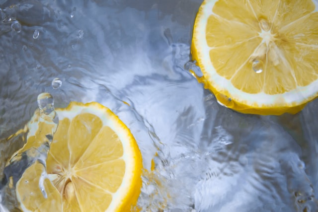 Lemon cut in half floating in water