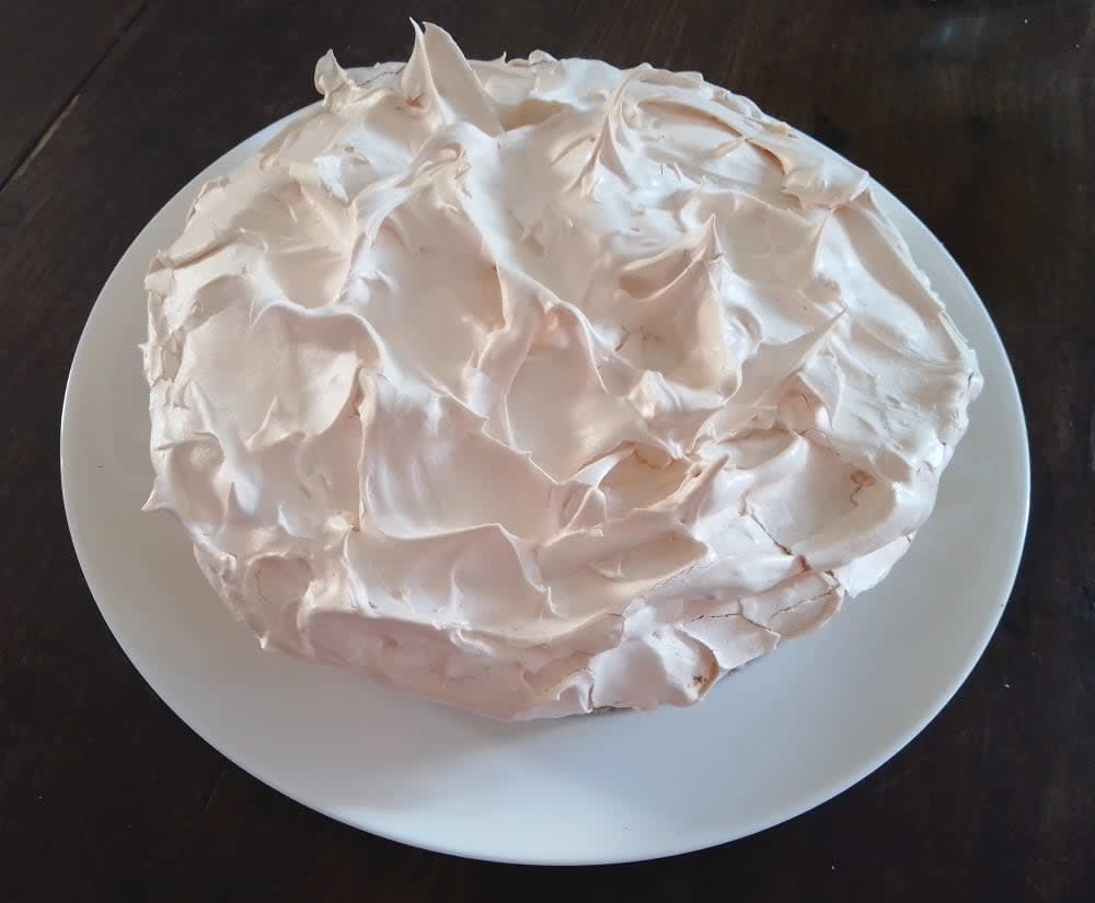 Lemon meringue pie on a plate on table
