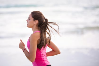 a girl runing on ocean beach/health/punjabmode