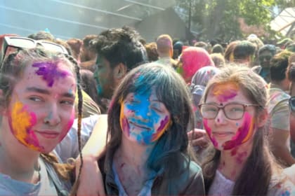 Three girls together celebration of holi with colours