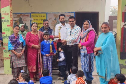 Balram Singh from Government Elementary School, Jhabal Kalan, Tarntaran, being honored for his outstanding performance in the State-Level Swimming Competition