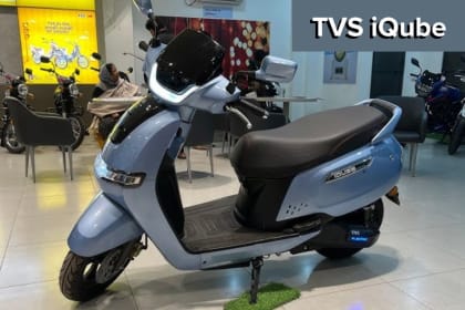 TVS iQube showcasing its stylish design with LED headlights and modern features, offering a 100KM range and powerful battery performance.