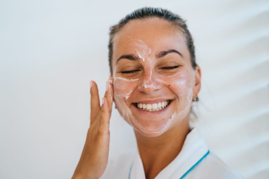 a women using double sunscreen cream for protecting our skin/health/punjabmode