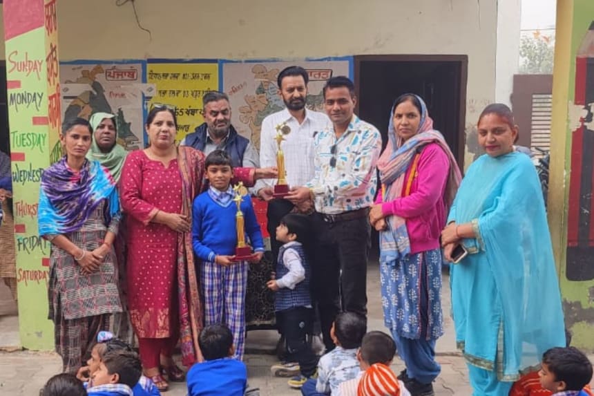 Balram Singh from Government Elementary School, Jhabal Kalan, Tarntaran, being honored for his outstanding performance in the State-Level Swimming Competition