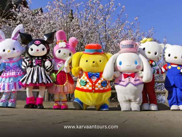 Adorable Sanrio characters including Hello Kitty and Pompompurin posing under cherry blossom trees in Japan.