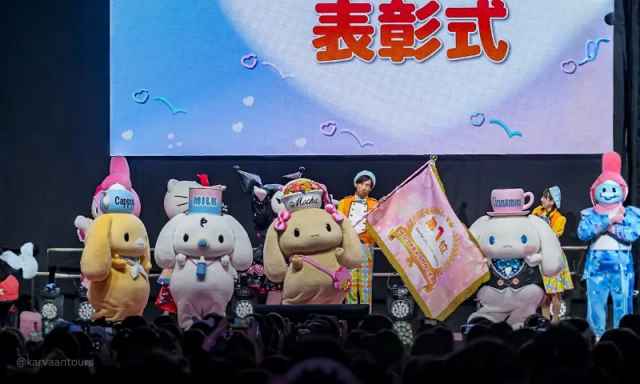 Sanrio characters on stage during awards ceremony event with audience at Sanrio Puroland Tokyo