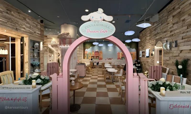 Pastel-themed Cinnamoroll Dream Cafe interior inside Sanrio Puroland Tokyo with decorative arch and seating area