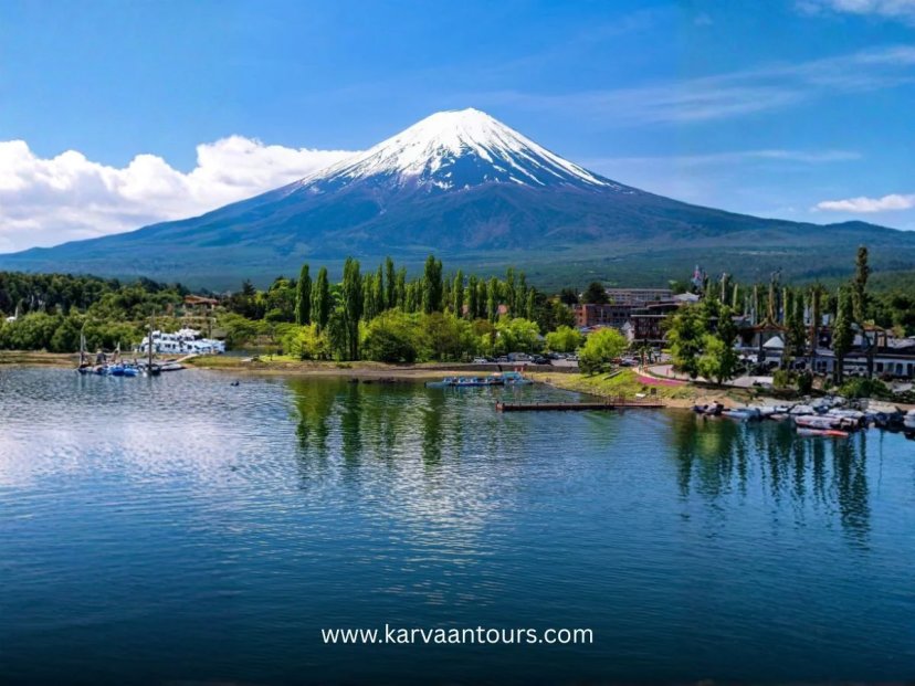 A lush park scene with Mt Fuji reflecting in a lake