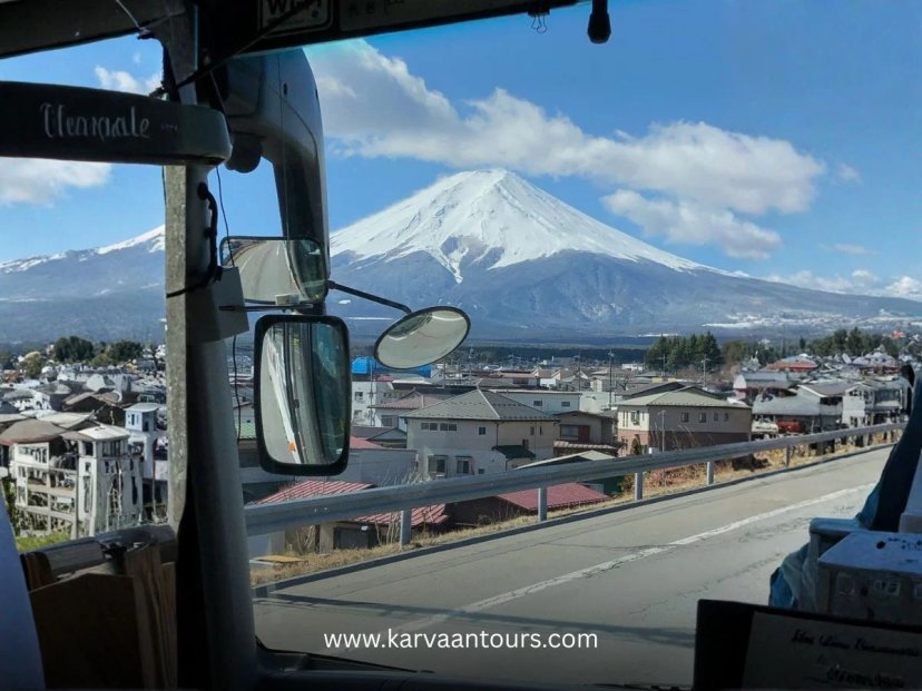 View of snow-capped Mount Fuji from a tour bus window