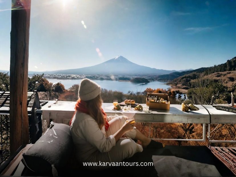 Woman enjoying breakfast with a direct view of Mount Fuji