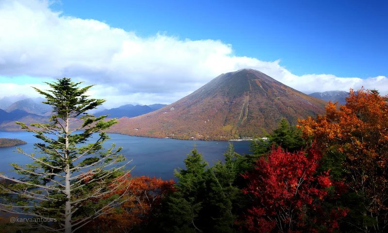 Autumn landscape with mountain lake and colorful trees in Japan