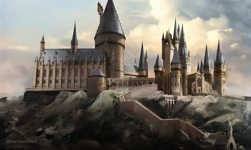 The main entrance plaza of Warner Bros. Studio Tour Tokyo featuring large digital screens displaying a flying Hungarian Horntail dragon.