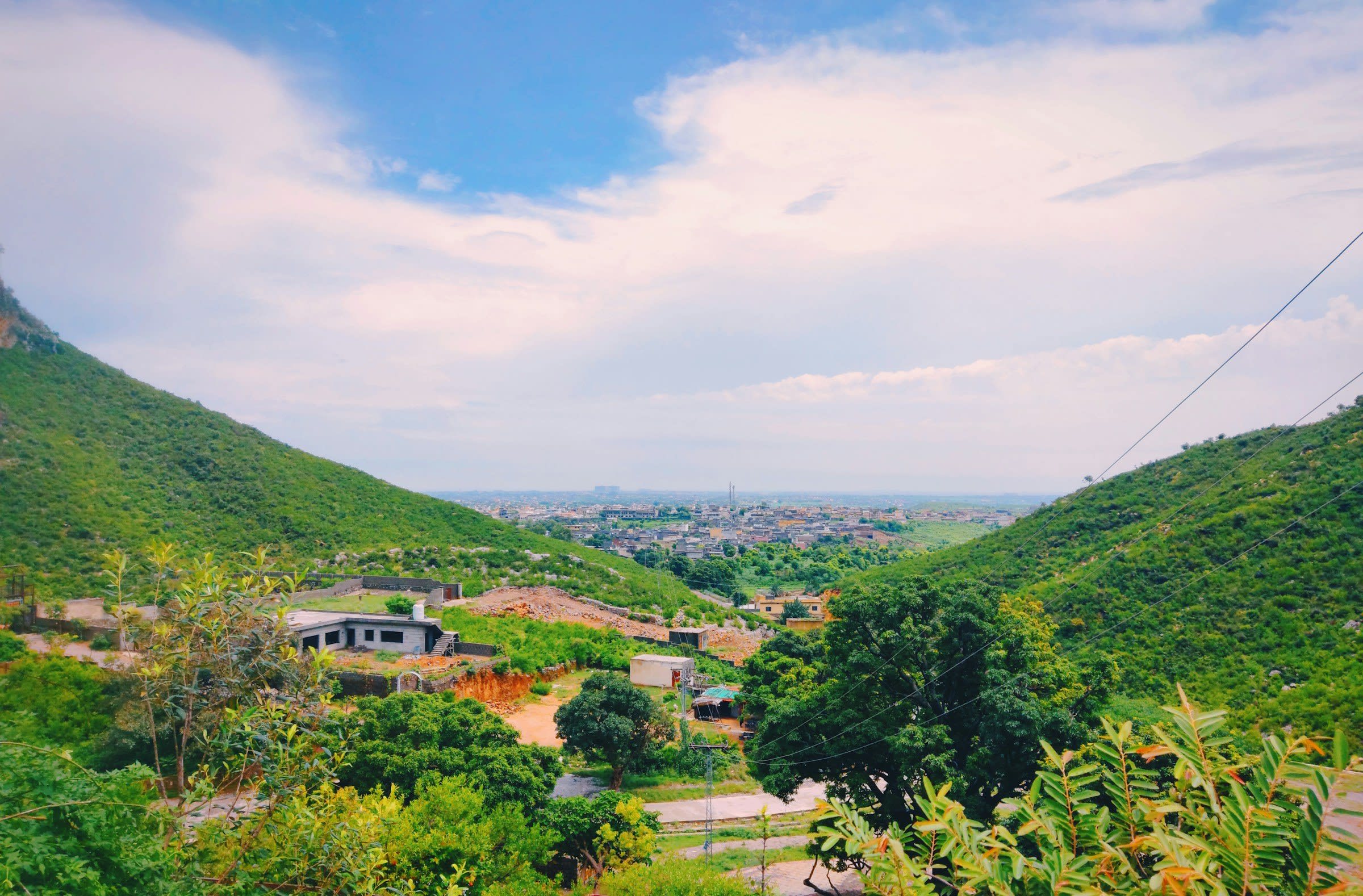 Residential districts spread across an Islamabad valley