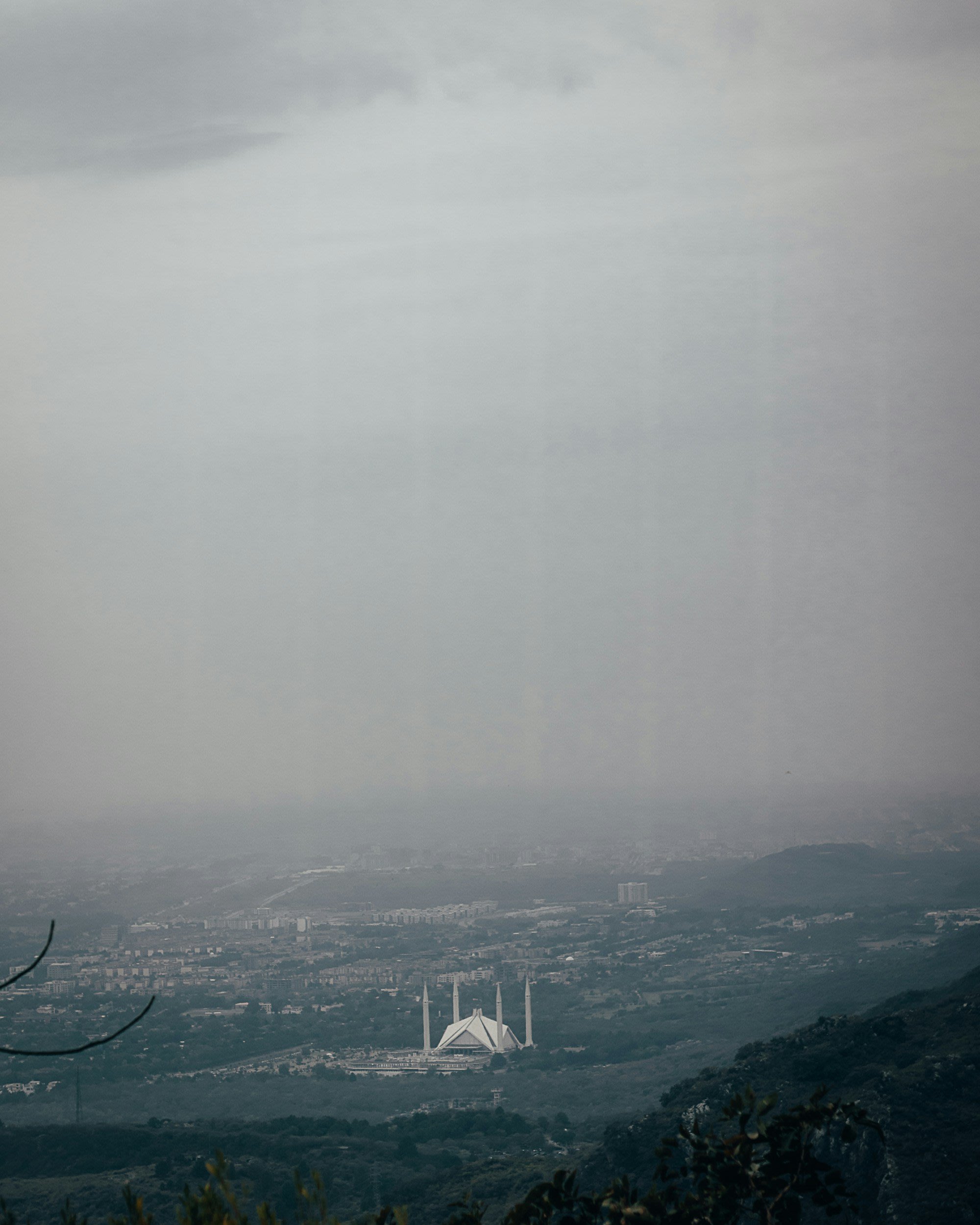 Islamabad city viewed through mist from the hills