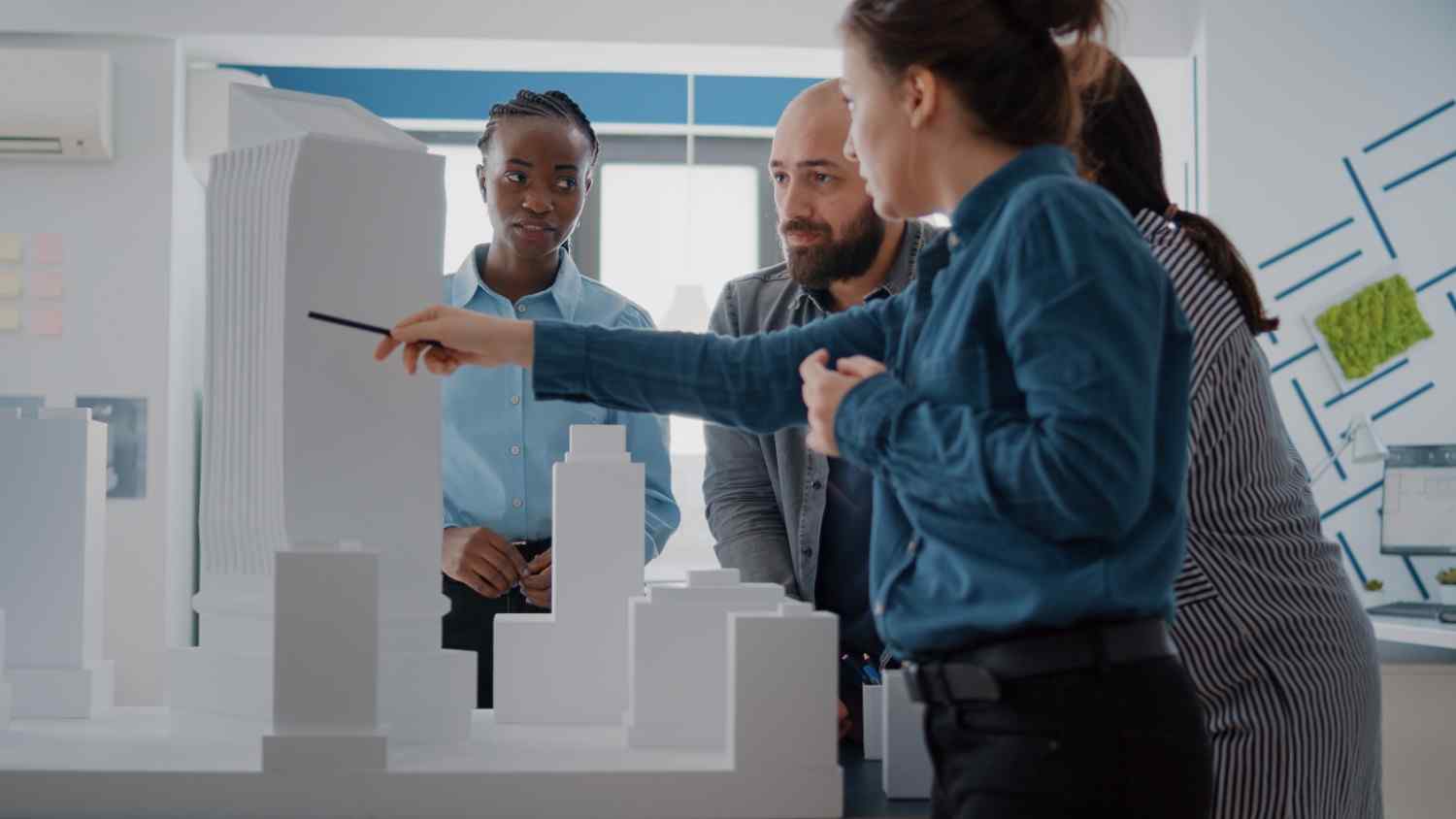 Team collaborating on a client briefing and company profile
