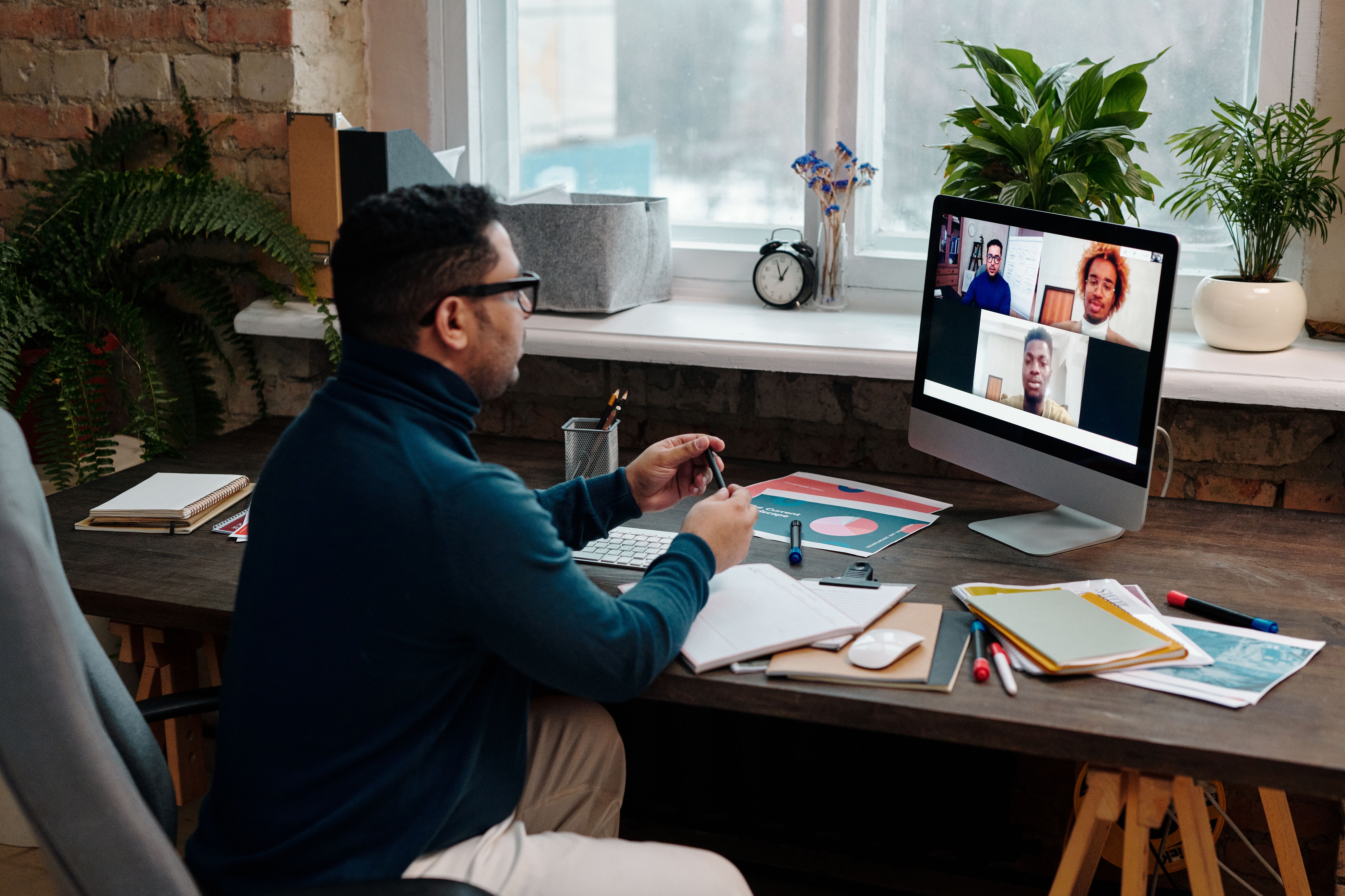 Professional joins a virtual meeting while using an AI note-taker to secure meeting discussions and notes.