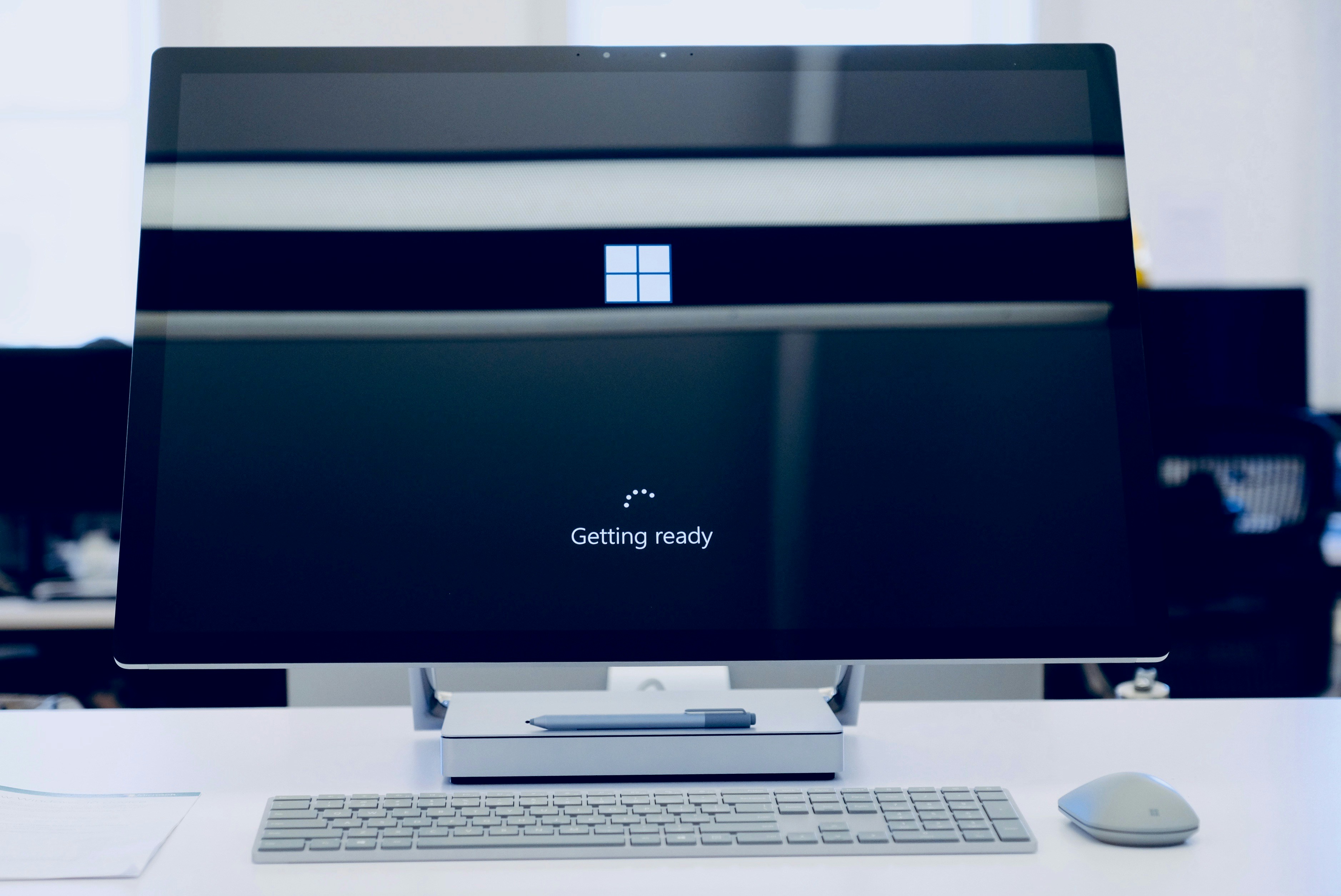 Desktop computer displaying the Windows startup screen, representing Windows 10 updates and business security.